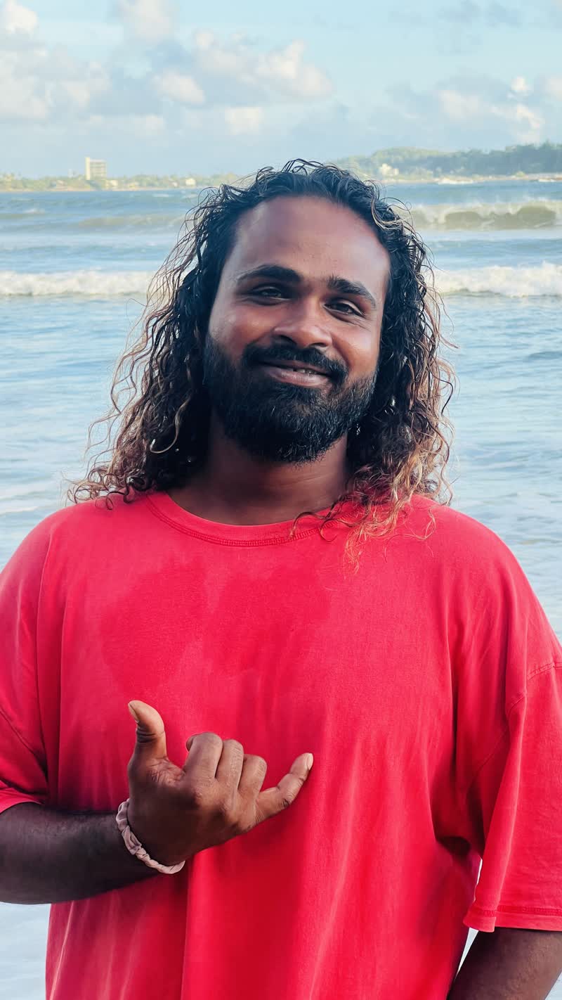 Lahiru Prasad, local surf instructor on the beach in Weligama, Sri Lanka